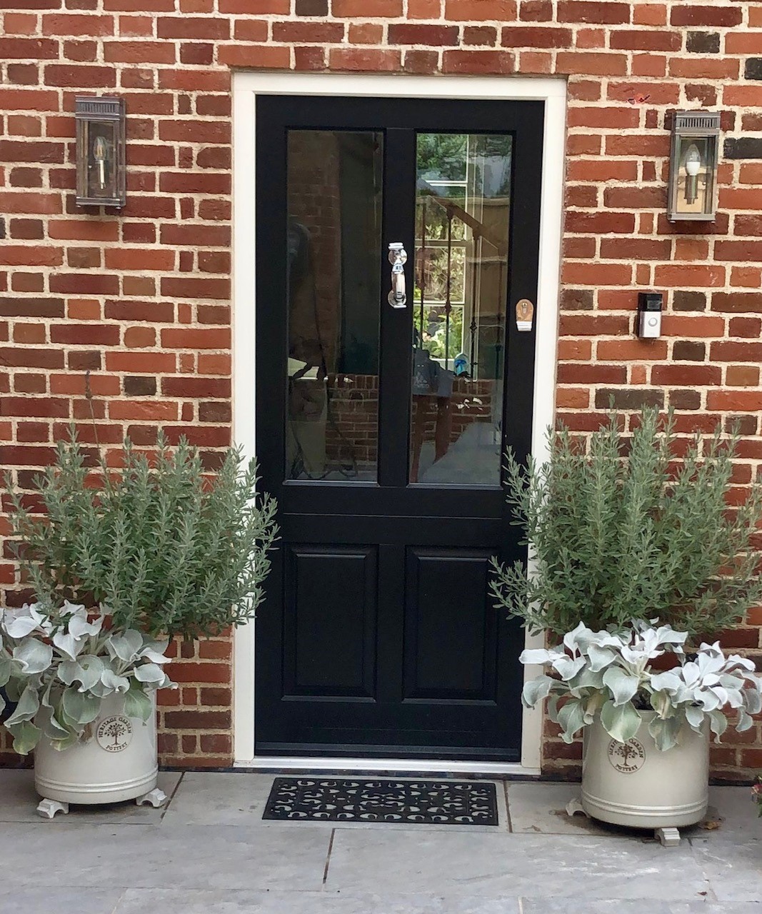 Present your front door with welcoming plants and a clean mat